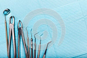 Dental and endodontic instruments in hands. Top view