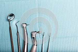 Dental and endodontic instruments on the napkin. Top view.