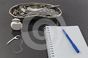 Dental equipment and instrument set for treatment on metal tray in clinic. Orthodontics and healthcare