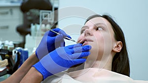 Dental examination at the dentist for young caucasian woman in dentistry.