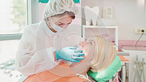 Dental examination at dentist for young caucasian woman in dentistry.