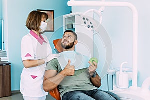 Dental examination of the patient. The dentist examines the patient`s teeth. Dentistry. Dental care.