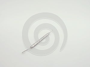 dental explorer on white background