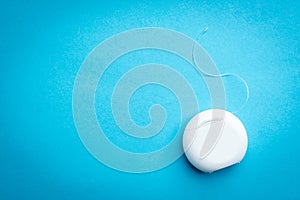 Dental floss on blue background