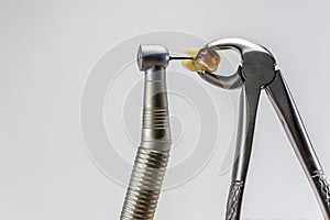 Dental forceps and dental turbine tip, decide to treat or remove tooth background, dental health