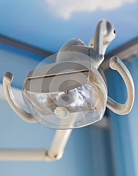 Dental health care concept background - Dental handle lamp close up. Dentistry and stomatology equipment