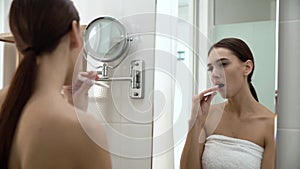 Dental Health. Woman Brushing Teeth In Bathroom