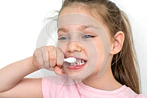 Dental hygiene. happy little girl brushing her teeth