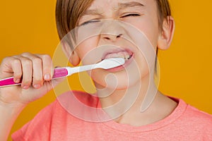 Dental hygiene. Little kid brushing her teeth. Kid boy brushing teeth. Boy toothbrush white toothpaste. Health care