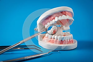 dental hygiene and treatment - tooth model and dentist tools