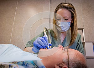 Dental Hygienist Cleaning Teeth