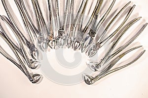 Dental instruments arranged in a pattern.