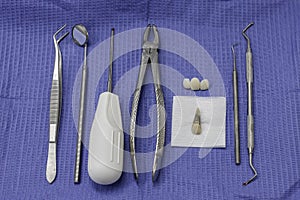 Dental Instruments and an Extracted Tooth