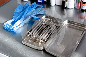 Dental instruments and medical gloves on the table