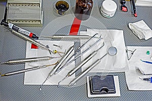 dental instruments with preparations on the table for dental restoration,