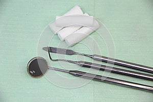 Dental instruments and swabs on a napkin