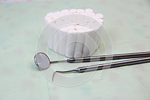 Dental instruments and swabs on a napkin