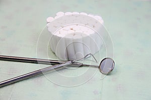 Dental instruments and swabs on a napkin