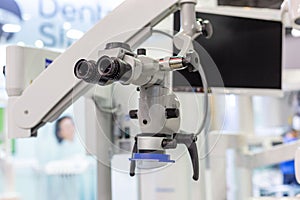 Dental microscope on the background of modern dentistry. Medical equipment. Dental operating microscope with rotary