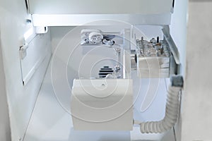 Dental milling computer-aided machine in a highly modern dental laboratory for teeth prosthesis and crowns milling.