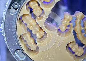 Dental milling machine carving out shape of human teeth