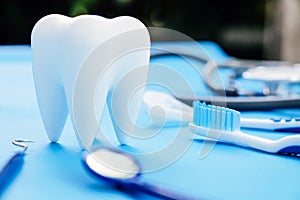 Dental model and dental equipment on blue background