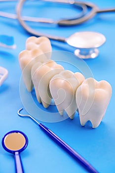 Dental model and dental equipment on blue background