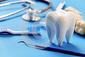 Dental model and dental equipment on blue background