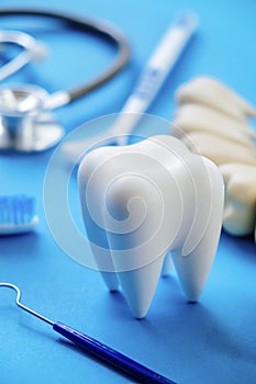 Dental model and dental equipment on blue background