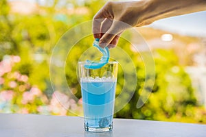Dental mouthpiece cleaning tablet in a glass photo