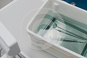 Dental and oral procedure tools in sterilising liquid