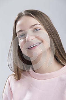 Dental and Oralcare Concepts.Portrait of Teenage Female Having Teeth Braces