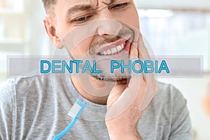 Dental phobia concept. Man suffering from toothache