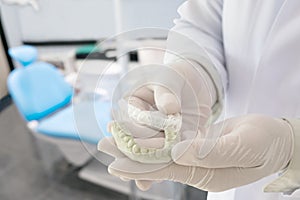 Dental retainer orthodontic appliance.
