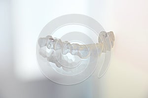 Dental splint from orthodontist for the therapy of malpositioned teeth. photo