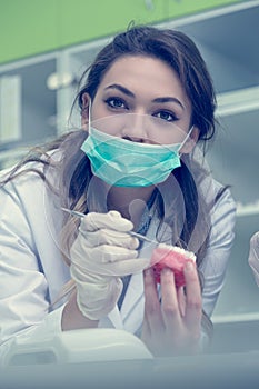 Dental students while working on the denture, false teeth.