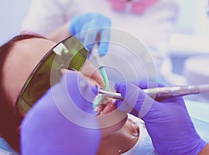 Dental team and patient at dentist's surgery