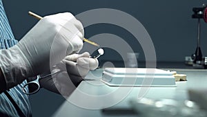 dental technician creates dental prostheses. laboratory. close-up.