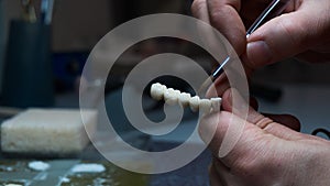 dental technician creates dental prostheses. laboratory. close-up.