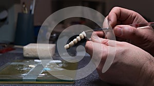 dental technician creates dental prostheses. laboratory. close-up.