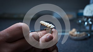 dental technician creates dental prostheses. laboratory. close-up.