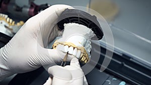 dental technician creates dental prostheses. laboratory. close-up.