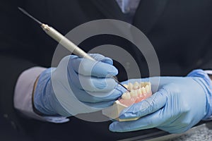 Dental technician or prosthesis worker. Prosthetic dentistry