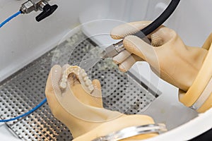 Dental Technician Working On 3D Printed Mold For Tooth Implants