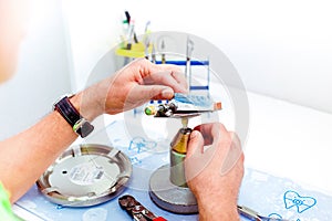 Dental technician working with artificial implants