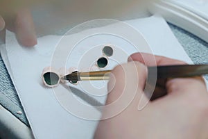 Dental Technician Working With Ceramic Crowns In Dental Laboratory.