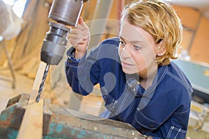 Dental technician working on milling machine