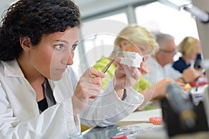 dental technician works on prosthesis