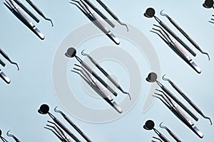 Dental tool pattern on a blue background