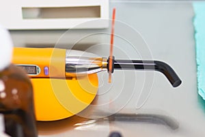 Dental tool ultraviolet curing light tool with UV light blocking glass